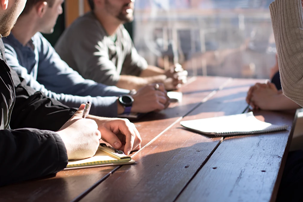 offshore design and development team shaking hands after agreement
